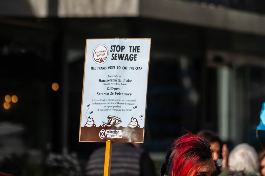A photo of Extinction Rebellion protesting against Thames Water polluting the River Thames in London